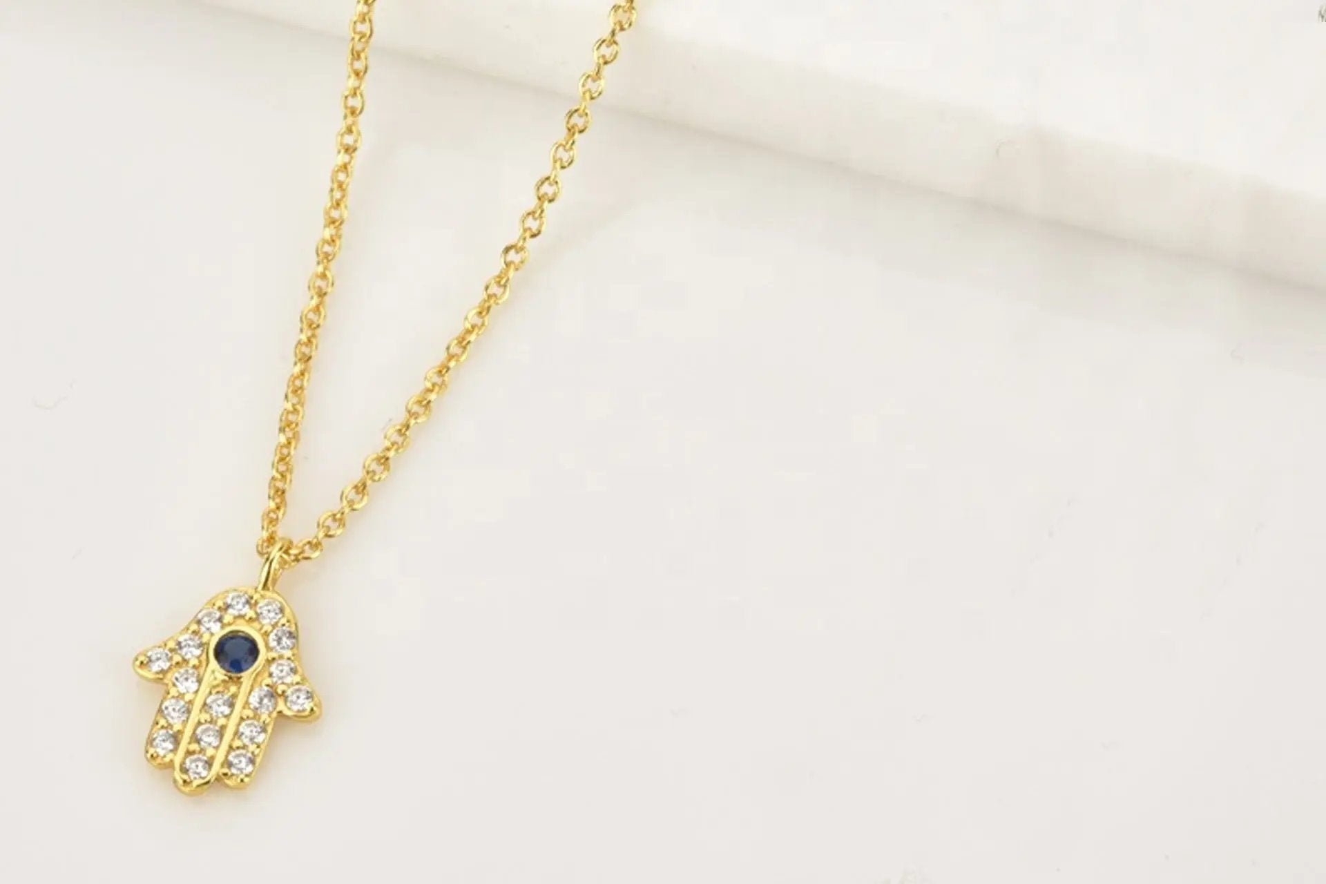 18K Gold Plated Hamsa Necklace With Blue Cubic Zirconia and White Zirconia Embellishment Primal Chakra